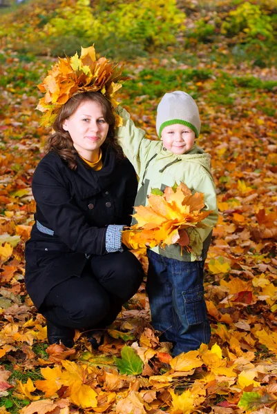 Boy in autumn leaves — Stock Photo, Image