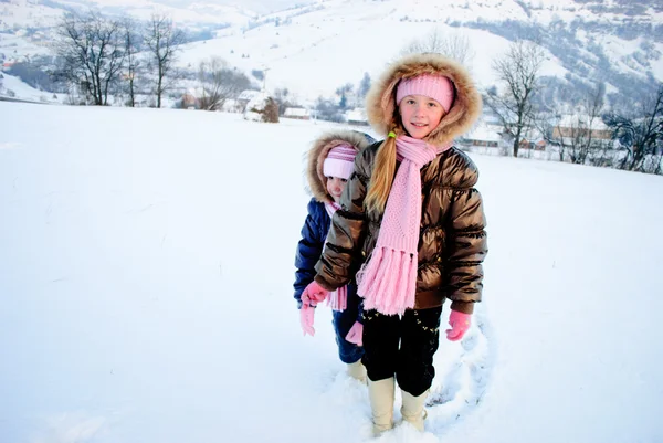 Sisters playing with snow — Stock Photo, Image