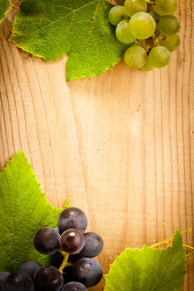 Grape on wooden table — Stock Photo, Image