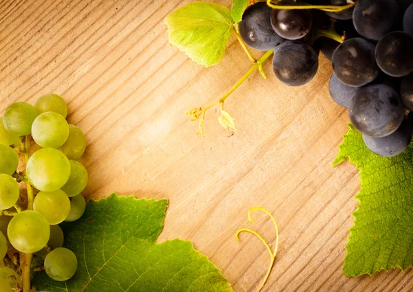 Grape on wooden table — Stock Photo, Image