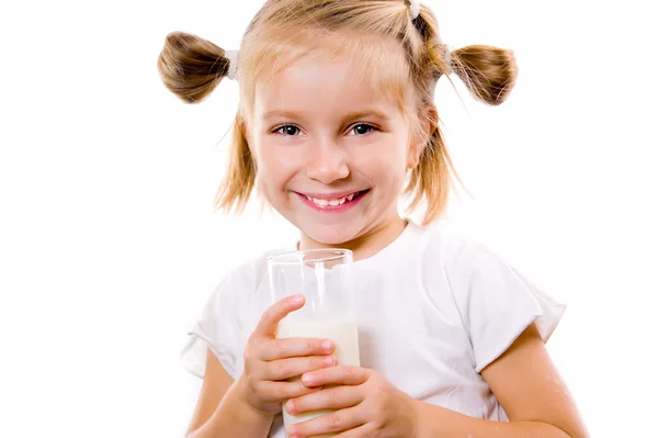 Portrait of a little girl holding a cup of milk — Stock Photo, Image