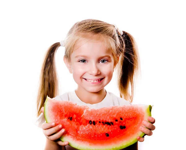 Klein meisje eten grote stuk van watermeloen — Stockfoto