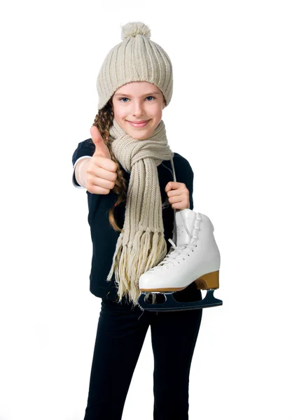 Schattig klein meisje met figuur schaatsen — Stockfoto