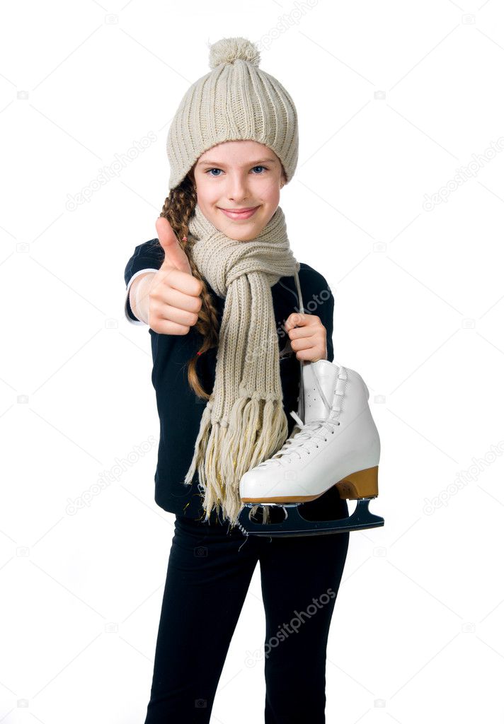 Cute little girl with figure skates