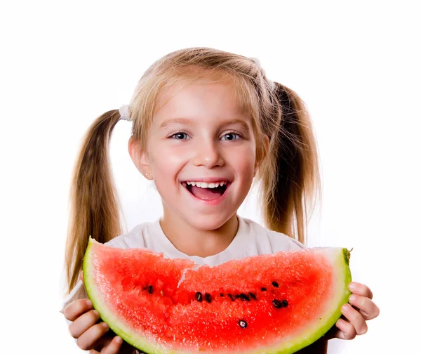 Liten flicka äter stor bit vattenmelon — Stockfoto
