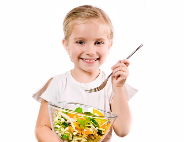 Маленькая девочка с овощами — стоковое фото