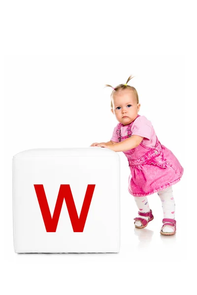 Little kid on the block with letter — Stock Photo, Image
