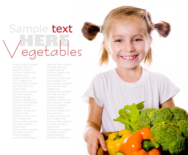 Маленька дівчинка з овочами — стокове фото