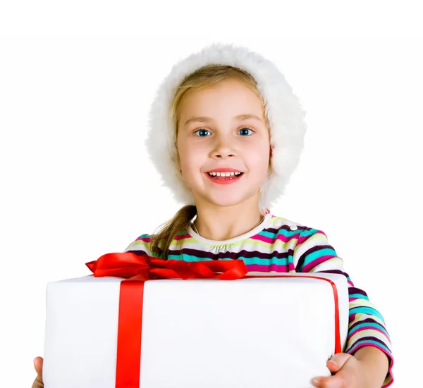 Ittle ragazza in cappello di Babbo Natale con regalo — Foto Stock