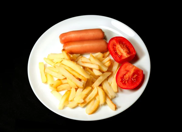 stock image Sausage served with french fries and tomatoes