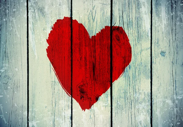 Símbolo de amor na parede de madeira velha — Fotografia de Stock