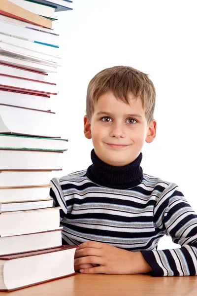 Школьник и куча книг, изолированных на белом фоне — стоковое фото
