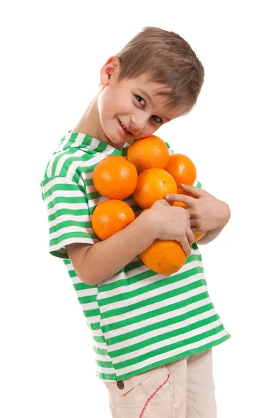 Boy holding oranges — Stock Photo, Image