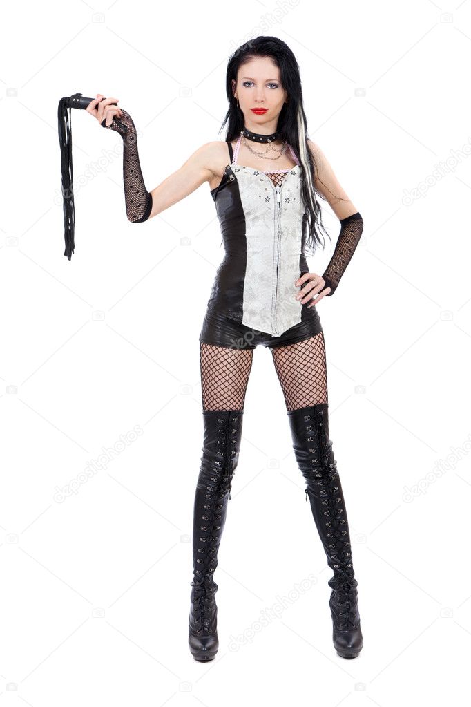 Sexy domina is holding a whip