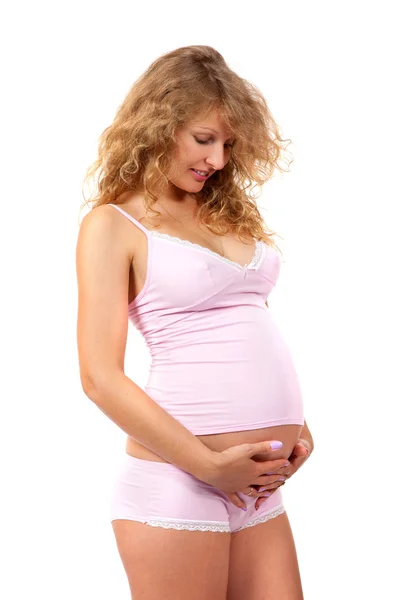Pregnant woman is caressing her belly — Stock Photo, Image