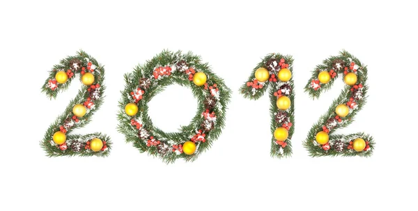 2012 número escrito por ramos de árvore de natal — Fotografia de Stock