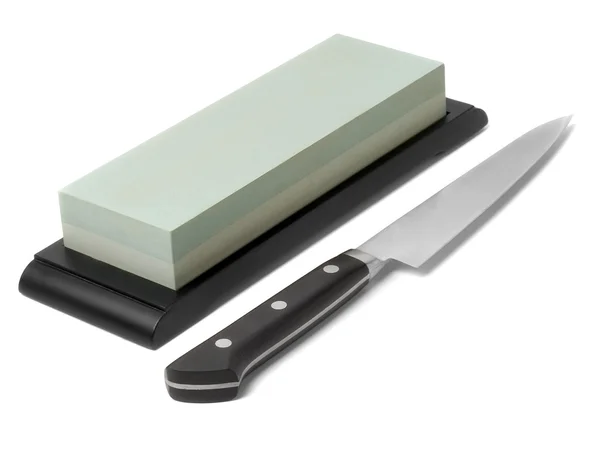 Sharpener stone and knife. — Stock Photo, Image