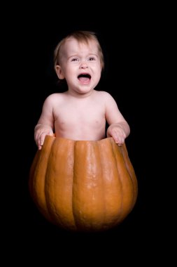 Baby in Large Pumpkin clipart