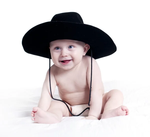 Barnet i en stor hatt — Stockfoto