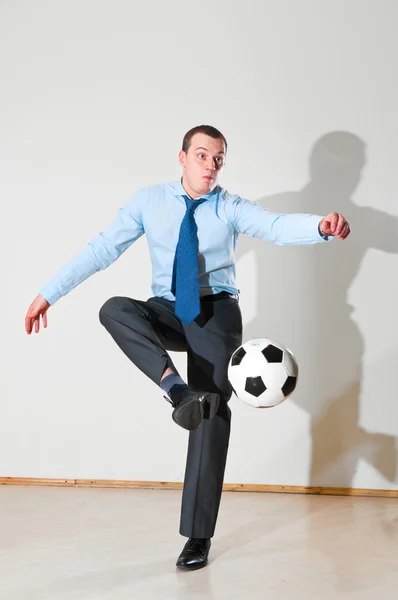 Playing football at office — Stock Photo, Image