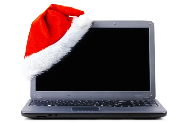笔记本电脑与圣诞老人帽子 — 图库照片