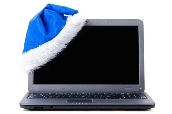 Noel Baba şapkası ile dizüstü bilgisayar — Stok fotoğraf