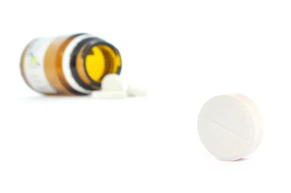 Píldoras de un frasco de medicina abierta —  Fotos de Stock