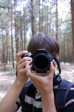 Long hair man with camera clipart