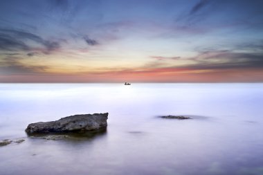 Deniz ve gün batımı, rock.