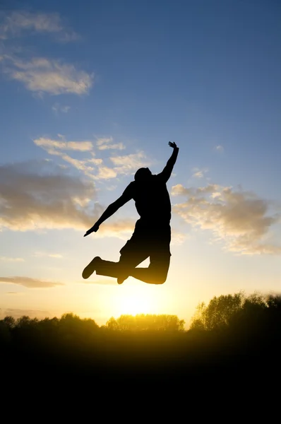 Jumping young man — Stock Photo, Image