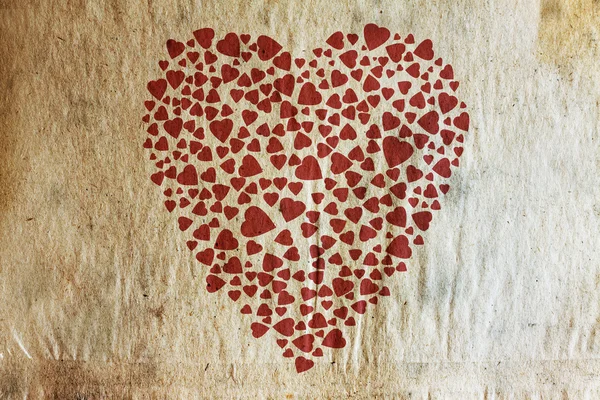 Ročník srdce na starý papír textury — Stock fotografie