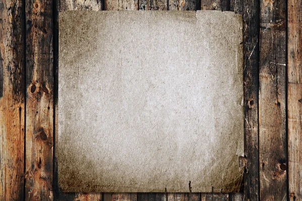 stock image Paper on old wood texture