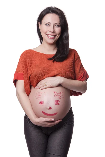 Een zwangere vrouw met een afbeelding op de buik — Stockfoto