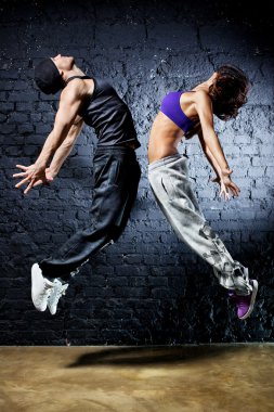 Young dancer couple jumping clipart