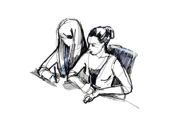 Две девочки в классе за столом — стоковое фото