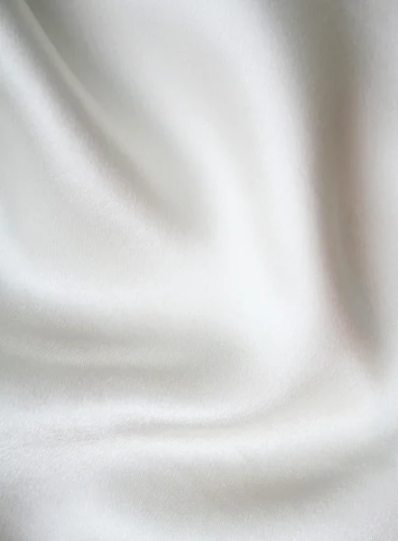 Гладкий элегантный белый шелк в качестве фона — стоковое фото