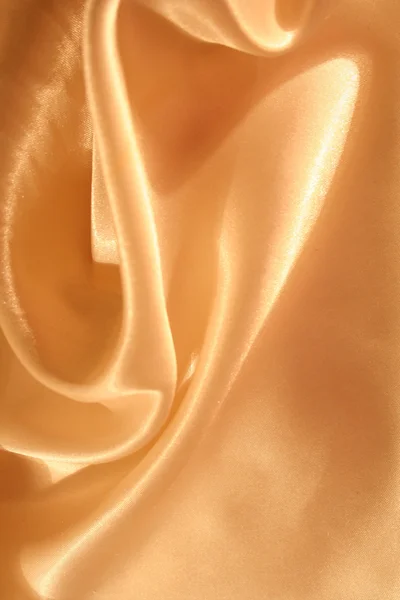 Suave elegante fundo de seda dourada — Fotografia de Stock