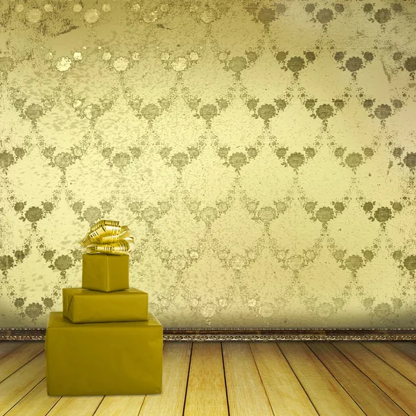 Present with bow in the old room with the remains former luxury — Stock Photo, Image