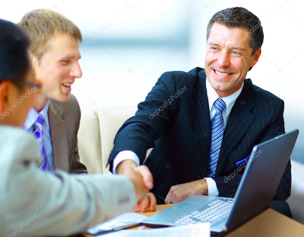 Business shaking hands, finishing up a meeting