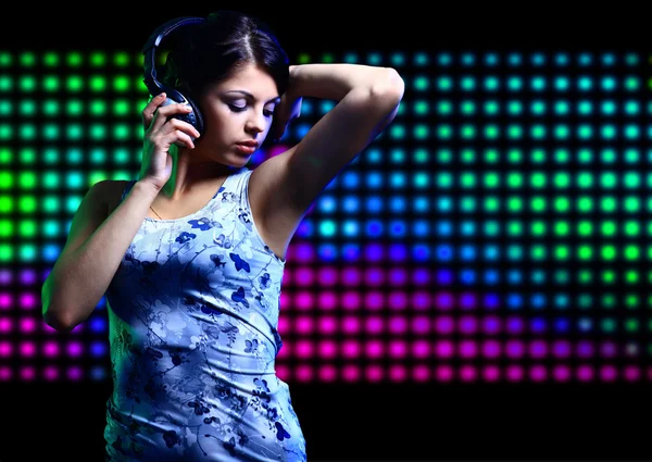 Portrait of a young dancing girl in headphones — Stock Photo, Image