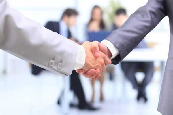 stock image Handshake isolated on business background