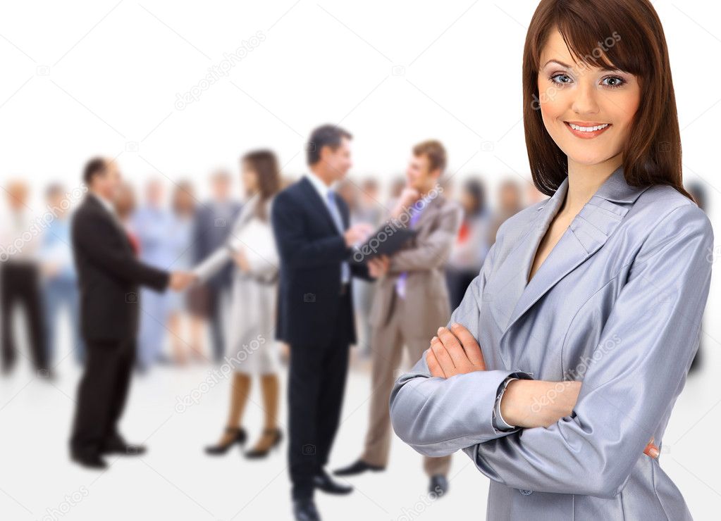 Happy young business woman standing in front of her team