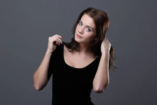 Young woman in black dress — Stock Photo, Image