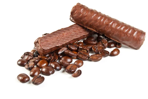 Chocolate candies and coffee beans — Stock Photo, Image