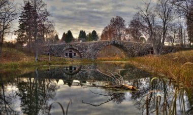 Arched boulder bridge clipart