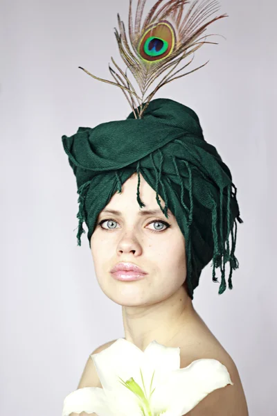Beautiful with a green bandage on a head — Stock Photo, Image