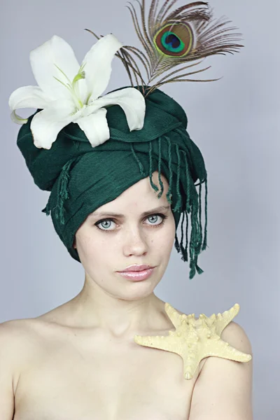 Girl in an exotic hat — Stock Photo, Image