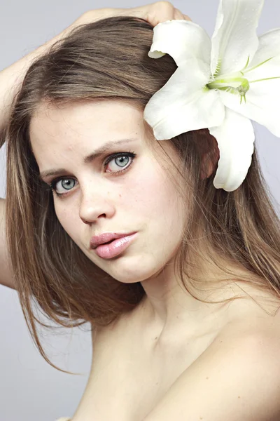 Mysterious girl with a lily — Stock Photo, Image