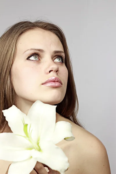 Woman and a flower — Stock Photo, Image