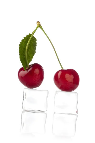 Sweet cherry with ice cube on white — Stock Photo, Image